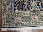 1950S SEMI ANTIQUE PERSIAN QUM TREE OF LIFE RUG, HAND-KNOTTED, WOOL, MIDNIGHT BLUE AND TAN, ANIMAL PICTORIALS, WRITTEN POEM IN BORDERS, 4' 8" X 7' 8"