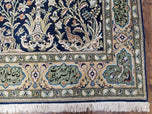 1950S SEMI ANTIQUE PERSIAN QUM TREE OF LIFE RUG, HAND-KNOTTED, WOOL, MIDNIGHT BLUE AND TAN, ANIMAL PICTORIALS, WRITTEN POEM IN BORDERS, 4' 8" X 7' 8"