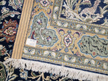 1950S SEMI ANTIQUE PERSIAN QUM TREE OF LIFE RUG, HAND-KNOTTED, WOOL, MIDNIGHT BLUE AND TAN, ANIMAL PICTORIALS, WRITTEN POEM IN BORDERS, 4' 8" X 7' 8"