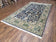 1950S SEMI ANTIQUE PERSIAN QUM TREE OF LIFE RUG, HAND-KNOTTED, WOOL, MIDNIGHT BLUE AND TAN, ANIMAL PICTORIALS, WRITTEN POEM IN BORDERS, 4' 8" X 7' 8"