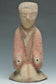 A HAN DYNASTY PAINTED POTTERY KNEELING ATTENDANT