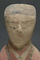 A HAN DYNASTY PAINTED POTTERY KNEELING ATTENDANT