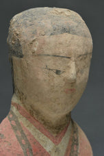 A HAN DYNASTY PAINTED POTTERY KNEELING ATTENDANT